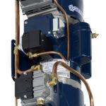a blue marathon air compressor with copper pipes attached to it