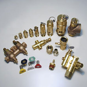 a bunch of brass valves and fittings on a white surface