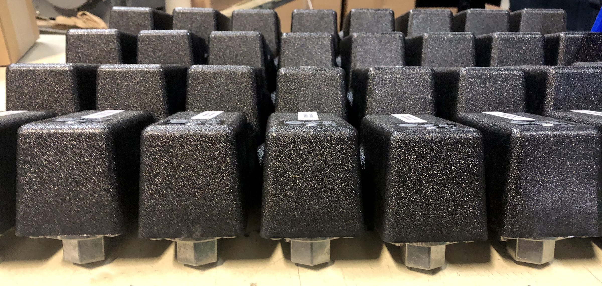 a row of black blocks with the letters t on them