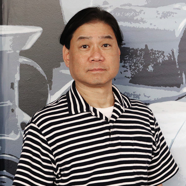 a man wearing a black and white striped shirt