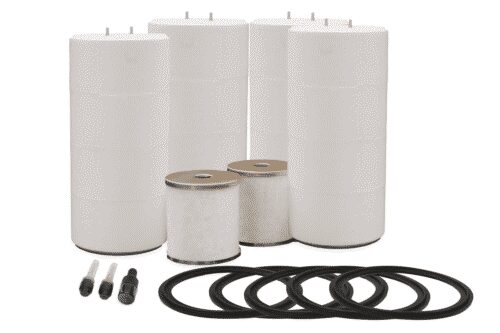 a bunch of white cylinders with rubber rings around them